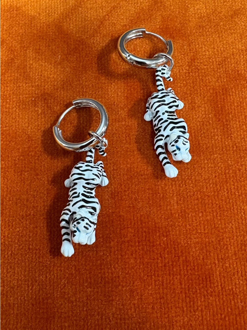 ManTepeller white enamel tiger hoop earrings. By Leandra Medine. Never worn